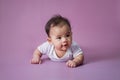 Baby laying on her belly in studio Royalty Free Stock Photo