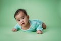 Baby laying on her belly in studio Royalty Free Stock Photo