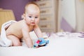 Cute baby looking at camera under a white towel. portrait of a cute child Royalty Free Stock Photo