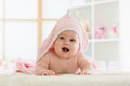 Cute baby lying on belly wrapped with pink towel after bathing Royalty Free Stock Photo