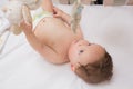 Cute baby lying in crib Royalty Free Stock Photo