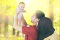 Cute baby and parents at autumn forest Royalty Free Stock Photo