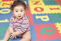 Cute baby on a play mat