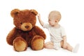Cute baby playing with big teddy bear on white Royalty Free Stock Photo