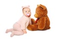 Cute baby playing with big teddy bear on white Royalty Free Stock Photo