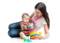 Cute baby playing with her mother isolated on white background