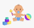 Cute baby playing with a rattle and cubes. Royalty Free Stock Photo