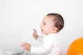 Cute baby playing and smiling with hands up Royalty Free Stock Photo