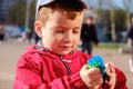 Cute baby playing with toy gum. Little boy having fun, grabbing. Family, childhood. Baby learning grab Royalty Free Stock Photo