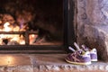 Cute purple sneakers drying on the heat of a fire place Royalty Free Stock Photo