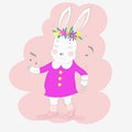The cute baby rabbit wearing a pink dress and dancing with music