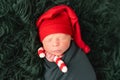 Cute baby in red santa hat sleeping Royalty Free Stock Photo