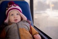 Cute baby riding bus look upside