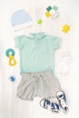 Cute baby romper,bodysuit,shorts,hat, socks,sneakers with toys,teethers. Set of kids,childrens clothes and accessories Royalty Free Stock Photo