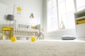 Cute baby room  with crib and big window, low angle view Royalty Free Stock Photo