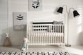 Cute baby room with crib and decor elements Royalty Free Stock Photo