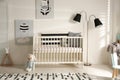 Cute baby room with crib and decor elements