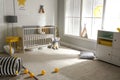 Cute baby room with crib and decor elements Royalty Free Stock Photo