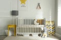 Cute baby room with crib and decor elements Royalty Free Stock Photo