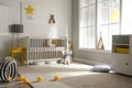 Cute baby room with crib and decor elements Royalty Free Stock Photo