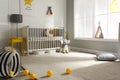 Cute baby room with crib and decor elements Royalty Free Stock Photo