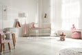 Cute baby room with crib and decor elements Royalty Free Stock Photo