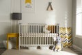 Cute baby room interior with crib and decor Royalty Free Stock Photo