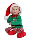 Cute Baby In Santa`s Elf Clothes Sitting On White Background. Christmas Suit