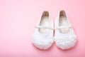 Cute baby shoes for kids on pink background. Royalty Free Stock Photo