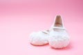 Cute baby shoes for kids on pink background. Royalty Free Stock Photo