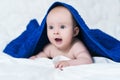 Cute baby after shower with blue towel on head Royalty Free Stock Photo