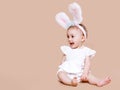 Cute baby sitting in costume easter bunny Royalty Free Stock Photo