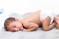 Cute baby sleeping on his stomach on bed Royalty Free Stock Photo