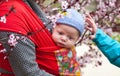 Cute baby in sling scarf