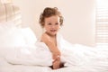 Cute little baby with soft towel on bed after bath Royalty Free Stock Photo