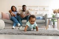 Cute baby toddler walking in living room making first steps Royalty Free Stock Photo