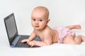 Cute baby typing on a laptop computer isolated on white Royalty Free Stock Photo