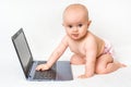 Cute baby typing on a laptop computer isolated on white Royalty Free Stock Photo