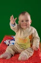 Cute baby waving hand in air Royalty Free Stock Photo