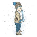 Cute baby in winter clothes. A boy in a jacket and jeans. Children`s f Royalty Free Stock Photo