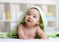 Cute baby in green towel after bathing Royalty Free Stock Photo