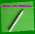 A cute `Back to school!` card with a little wooden pencil on a green paper sheet for notes! Royalty Free Stock Photo