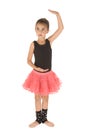 Cute ballerina girl posing in dance position in pink tutu