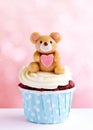 Cute bear cupcake on pink background
