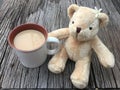 Cute bear doll with morning milk coffee