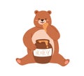 Cute bear eating honey from paw. Happy teddy with pot. Funny baby animal and honeypot. Positive lovely childish