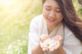 Cute beautiful Asian healthy plump plus size girl teen with flower outdoor happy smile Royalty Free Stock Photo