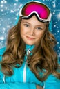 Cute, beautiful blonde young girl dressed in ski outfit Royalty Free Stock Photo