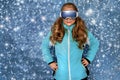 Cute, beautiful blonde young girl dressed in ski outfit Royalty Free Stock Photo