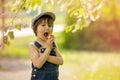 Cute beautiful child, boy, eating strawberries and in the park Royalty Free Stock Photo